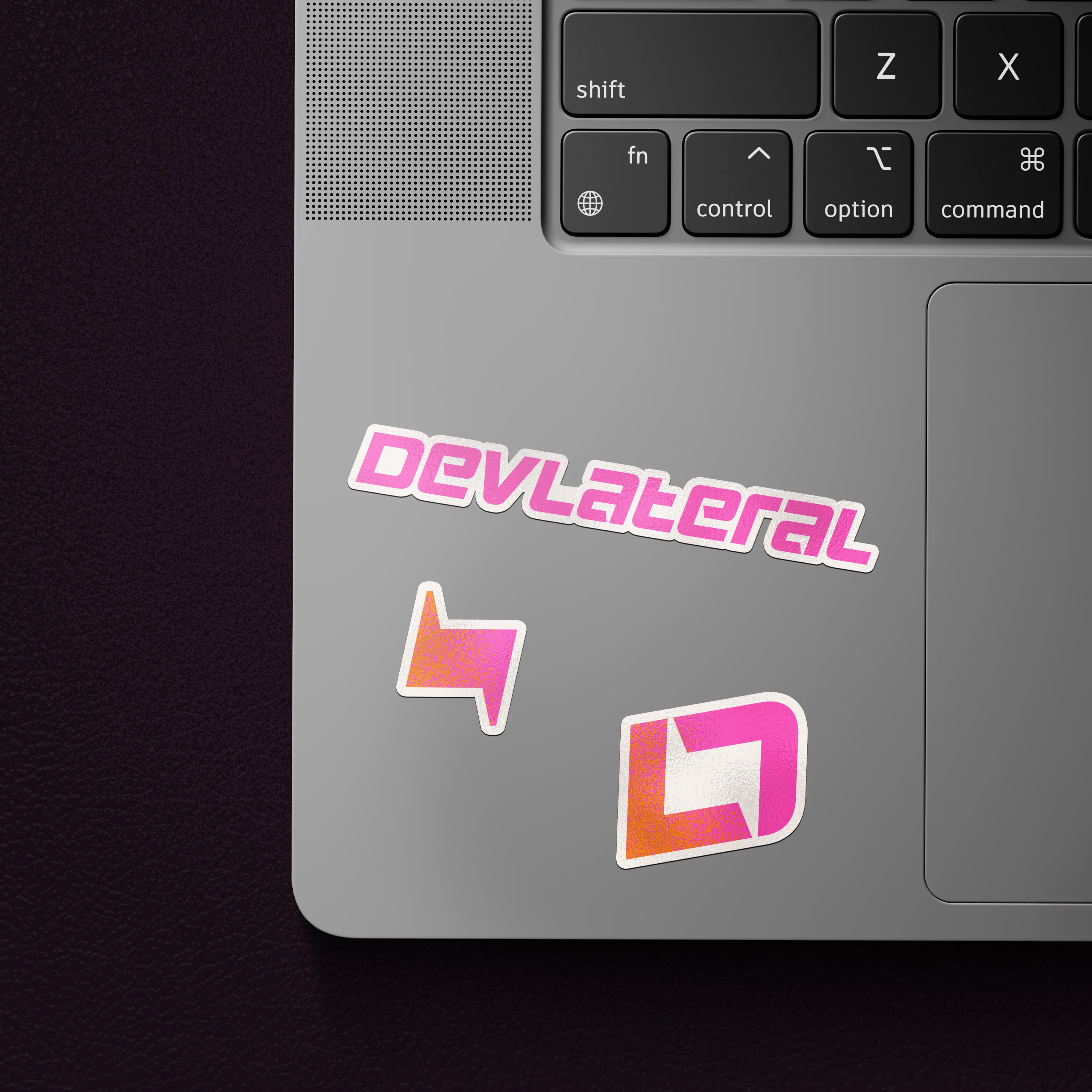 Devlateral Stickers On Mac Laptop